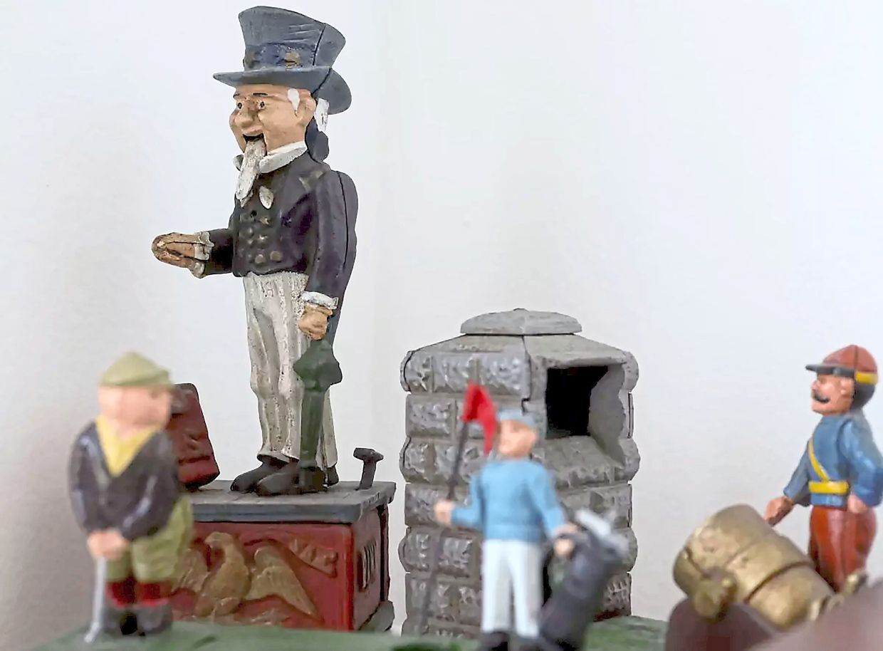 Chait's collection of vintage mechanical banks. 