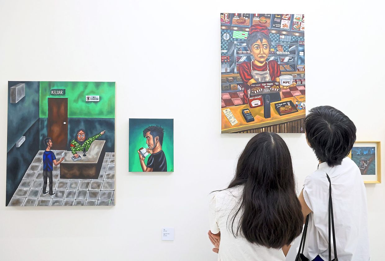 Visitors view Hieng’s Innocent Bystander works at The Back Room, featuring paintings inspired by his everyday life in China and Malaysia.