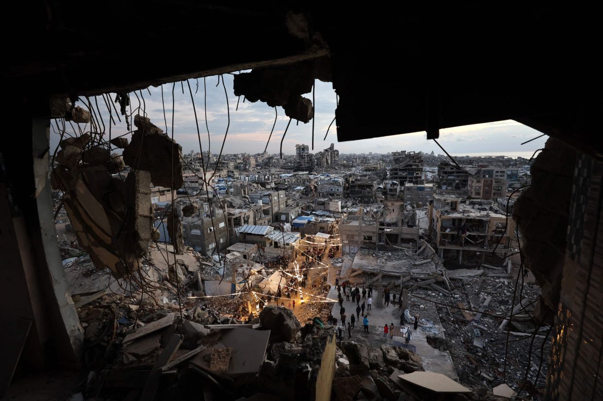 Gazans salvage ancient books in mosque library damaged by war