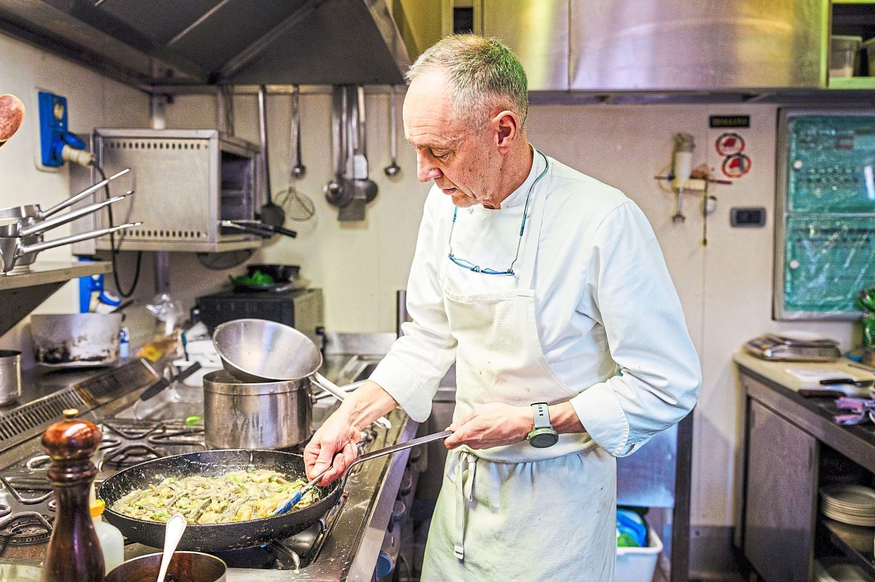 Chef Luca Cantoni prepares pizzoccheri in the kitchen at Fracia, his restaurant in Chiuro, Italy.