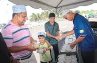The true cost of 320 bowls of bubur lambuk