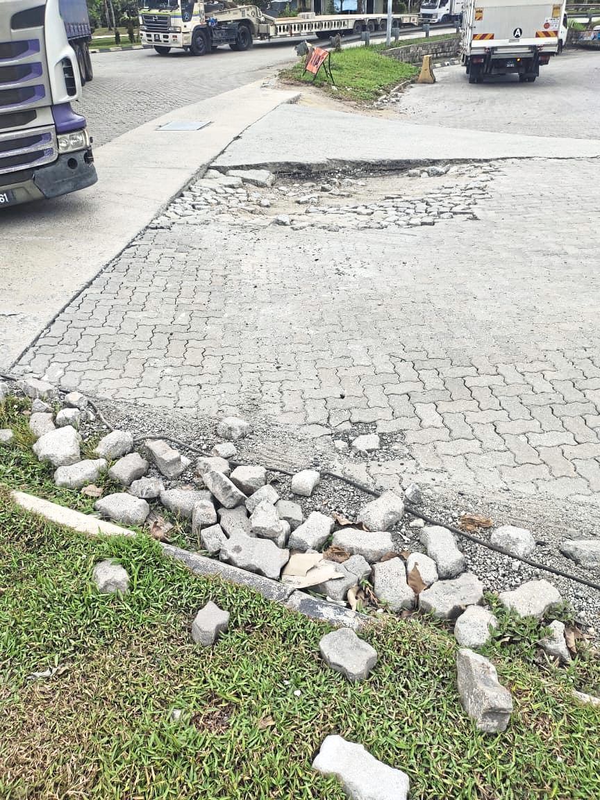 Potholes and road damage at lorry lanes at the Sultan Abu Bakar CIQ Complex at the Second Link in Johor.