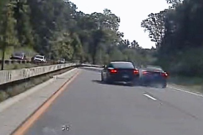 Vince McMahon's car (center left) collides with another car. Photo: AP