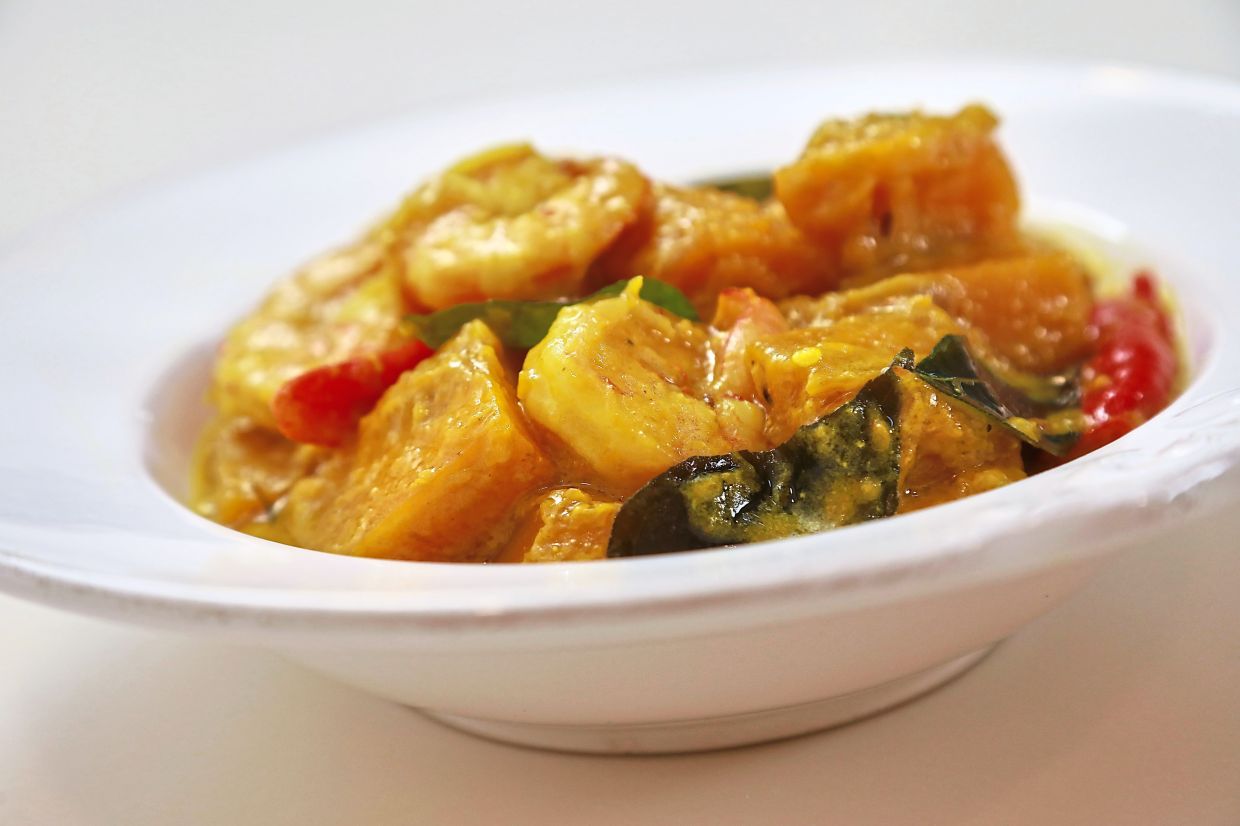 Pumpkin and prawns cooked in coconut milk make for a tasty dish. — YAP CHEE HONG/The Star