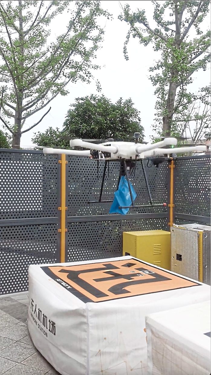 A delivery drone carrying a lunch order takes off from a launch site. — Qilai Shen/The New York Times