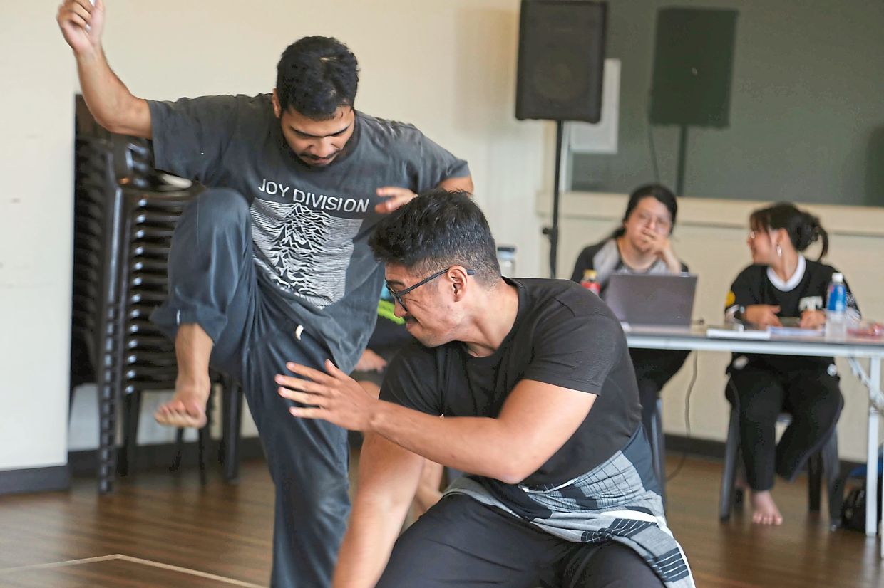 Daniel and Muhammad practice the fight scene in a rehearsal session. Photo: KLPac
