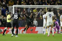 Soccer-Man City move two points behind Arsenal after 1-0 win at Leeds