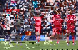 Soccer-Liverpool surge to 5-2 win over West Ham, Brentford and Everton win