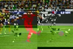 Soccer-Kane double, Kimmich strike give leaders Bayern 3-2 comeback win at Dortmund