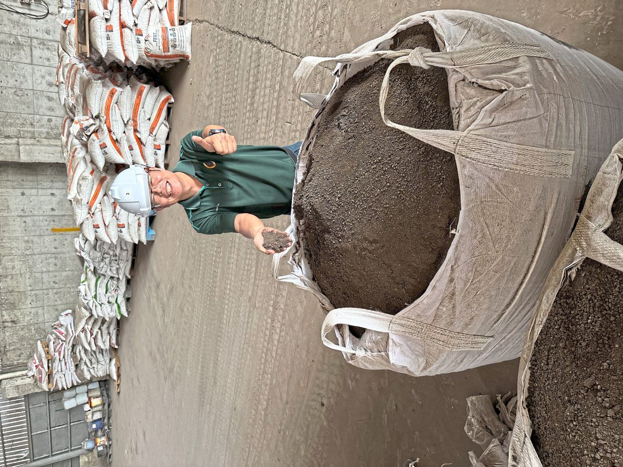 Tan showing organic fertiliser which QL Poultry Farms is keen to market.