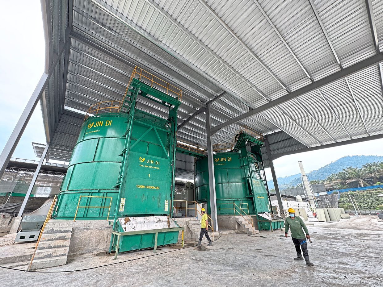 Two 200 cubic metre towers where fresh manure is composted (above) and a trench system, still under construction (below), are part of the waste management systems at QL Poultry Farms in Pajam.