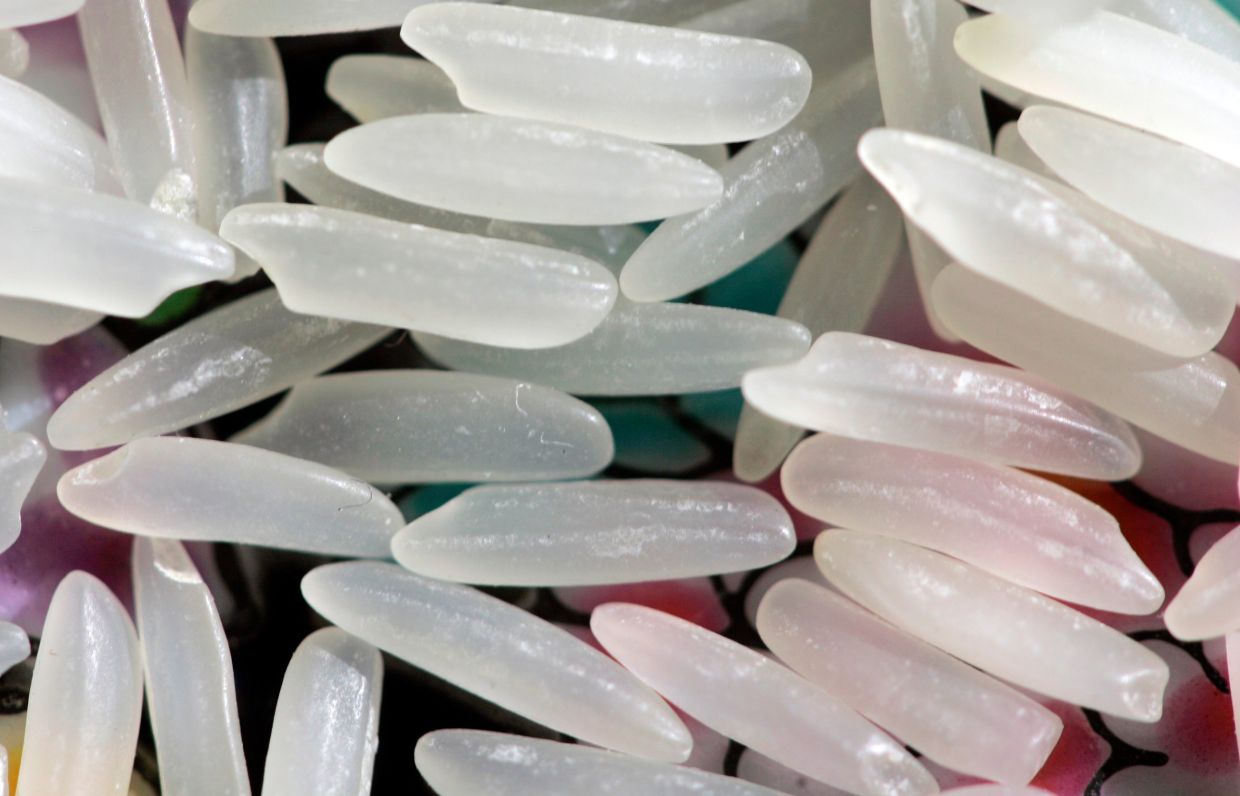 Grains of uncooked jasmine rice. — AP/Carolyn Kaster, File
