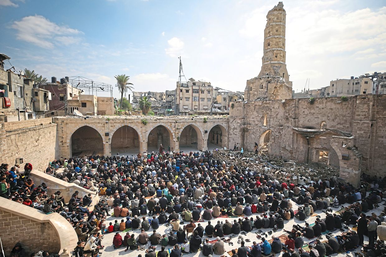 Palestinians gathered for Friday prayers at the Great Omari Mosque in Gaza City in February last year. It was damaged during Israeli military air and ground operations. Photo: AP