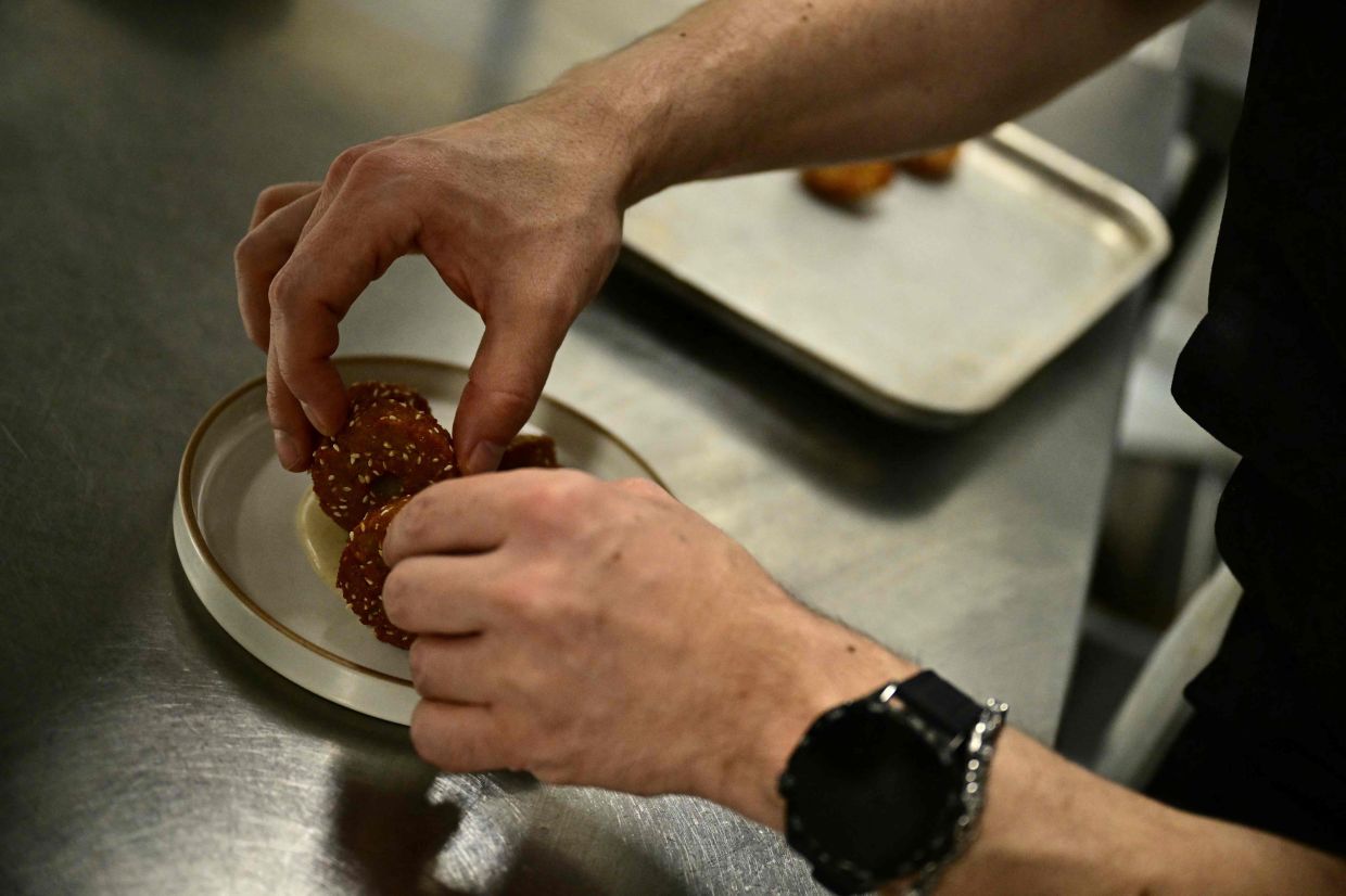 Imad Alarnab working at one of his restaurants in central London.