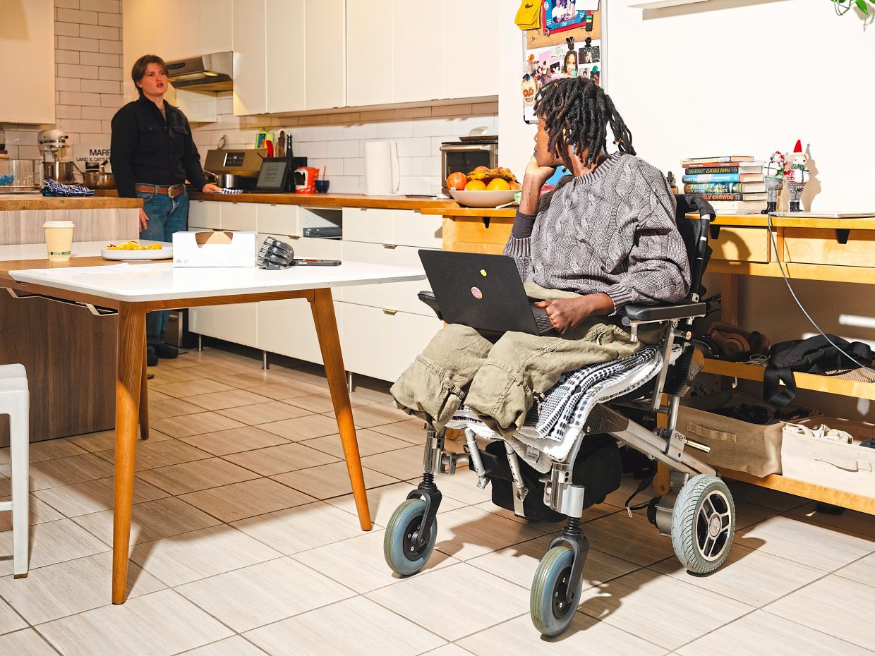 Komolafe (right) talks through a recipe with her cooking assistant, Stasia de Tilly, at home in New York.