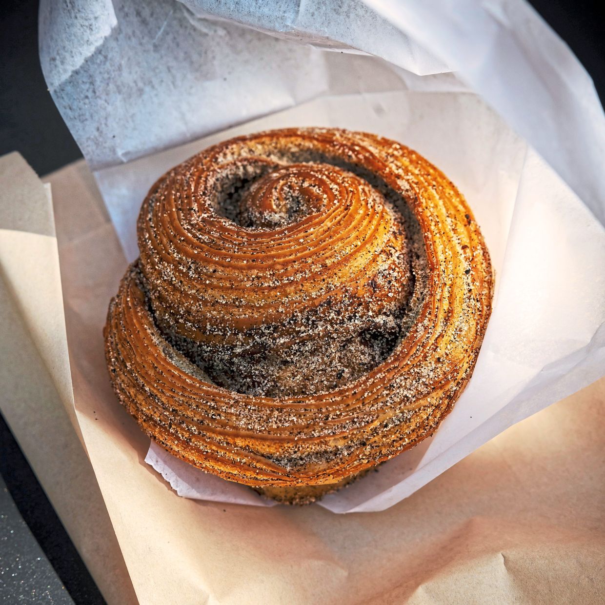 After her tracheal breathing tube was removed, Komolafe was able to eat the foods she'd once enjoyed, like this Earl Grey morning bun.—KARSTEN MORAN/The New York Times