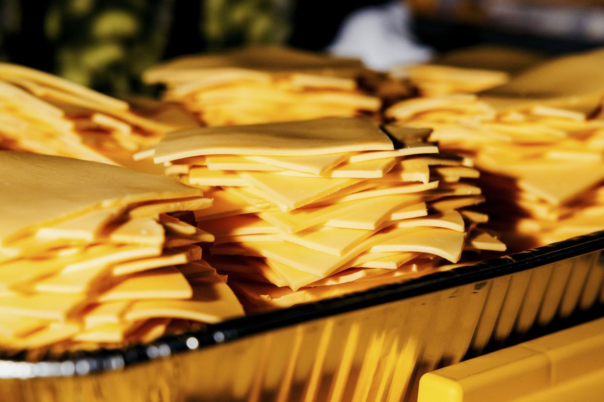 American cheese ready to top burgers at the Burger Bash .