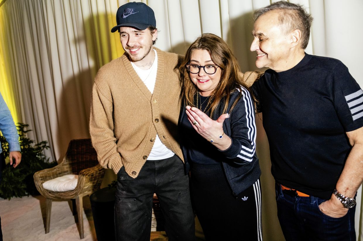 (From left) Brooklyn Beckham with his Burger Bash co-host, Rachael Ray, and Lee Schrager, founder and director of the Food Network South Beach Wine & Food Festival, at the festival in Miami Beach.