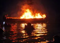 Frantic responders dive into sea as boat catches fire during body retrieval mission