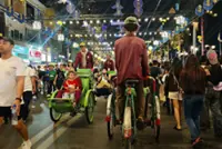 Despite shrinking returns, cyclo riders keep wheels turning on Phnom Penh walking street