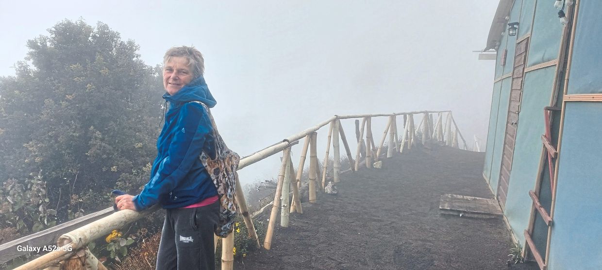 The writer's wife at the viewing point of Mount Acatenango.