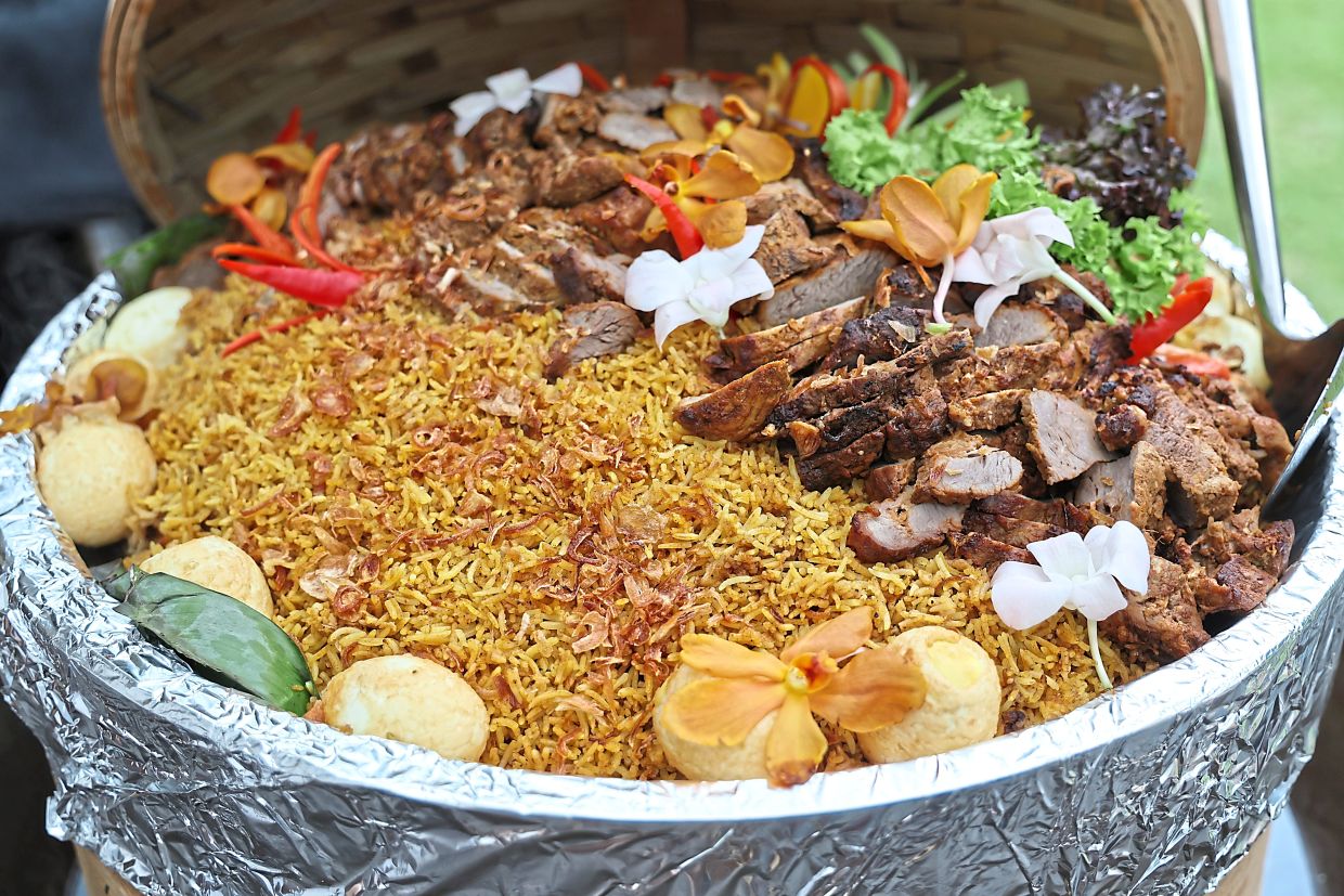 The Nasi Briyani Gam goes perfectly with the gravy cooked in communal woks.