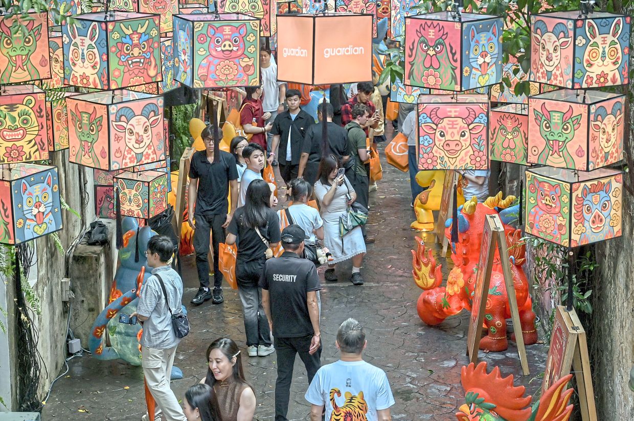 The soft glow of the lanterns illustrated with the Chinese zodiac animals creates a special ambiance at Kwai Chai Hong in Chinatown.