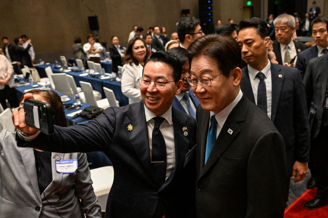 A delegate taking a photo with South Korean President Lee Jae Myung at the Philippines-Korea Business Forum in Pasay, Metro Manila, Philippines on March 4, 2026. - Reuters