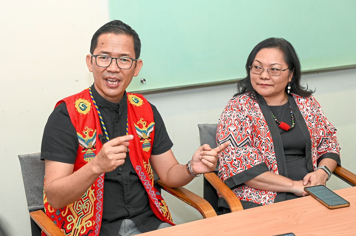 Stateless no more: Soliman speaking to the press as his wife Jubik looks on. — IZZRAFIQ ALIAS/The Star