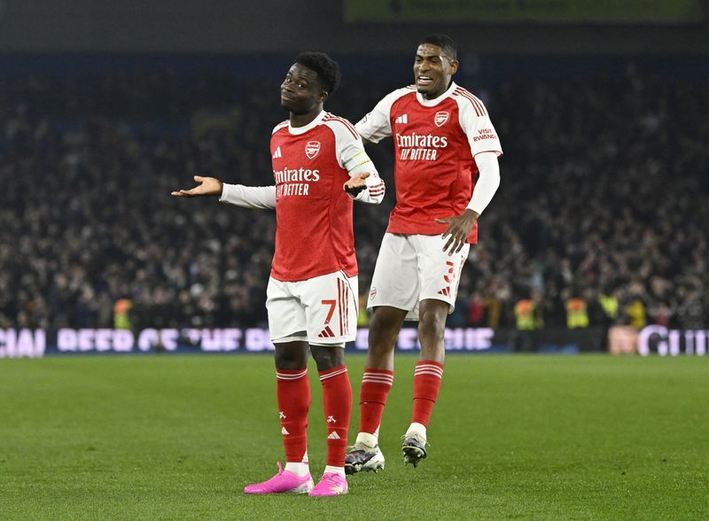 Soccer-Arsenal seize control as Man City slip, Chelsea thrash Villa