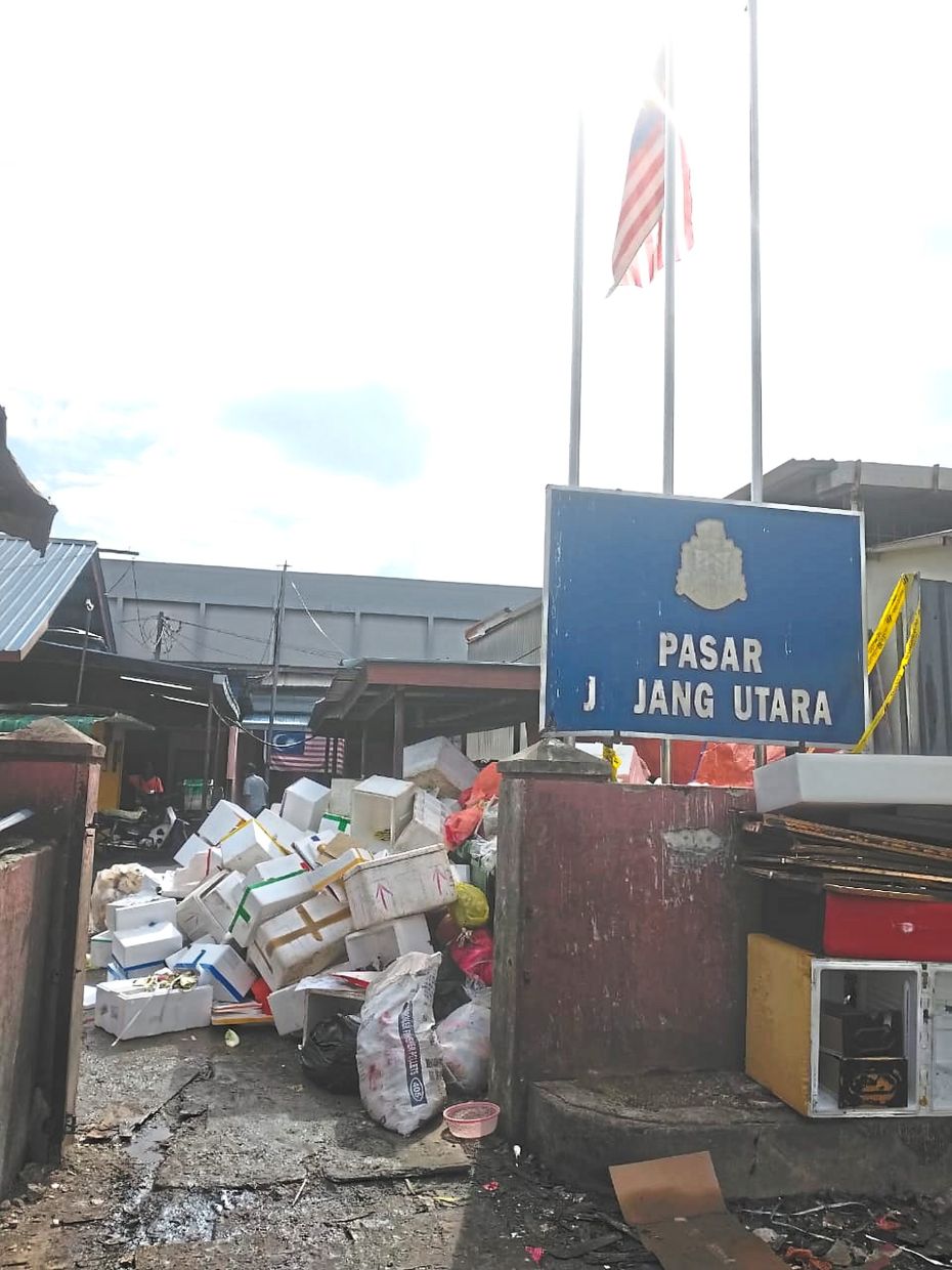  The current rubbish disposal situation within the market compound (right) is expected to improve.