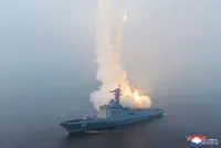 Kim oversees warship, cruise missile test