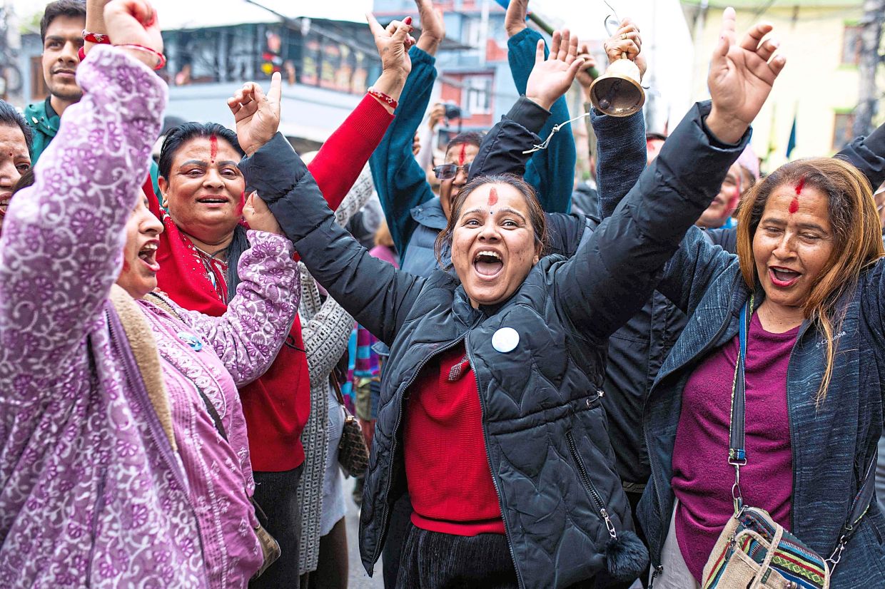 Supporters of the Rastriya Swatantra Party (RSP) celebrate as counting began in Kathmandu on March 6, 2026 a day after Nepal's Parliamentary election. Counting was underway in Nepal on March 6, after a high-stakes parliamentary election to reshape the country's leadership following 2025 protests that toppled the government. (Photo by PRABIN RANABHAT / AFP)