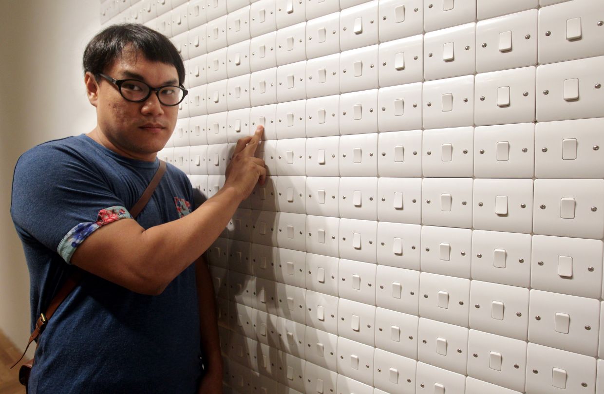 Artist chi too with his 2013 light switch installation 'What Turns Me On', later acquired by the National Art Gallery and now part of the national collection. Photo: The Star/Filepic 