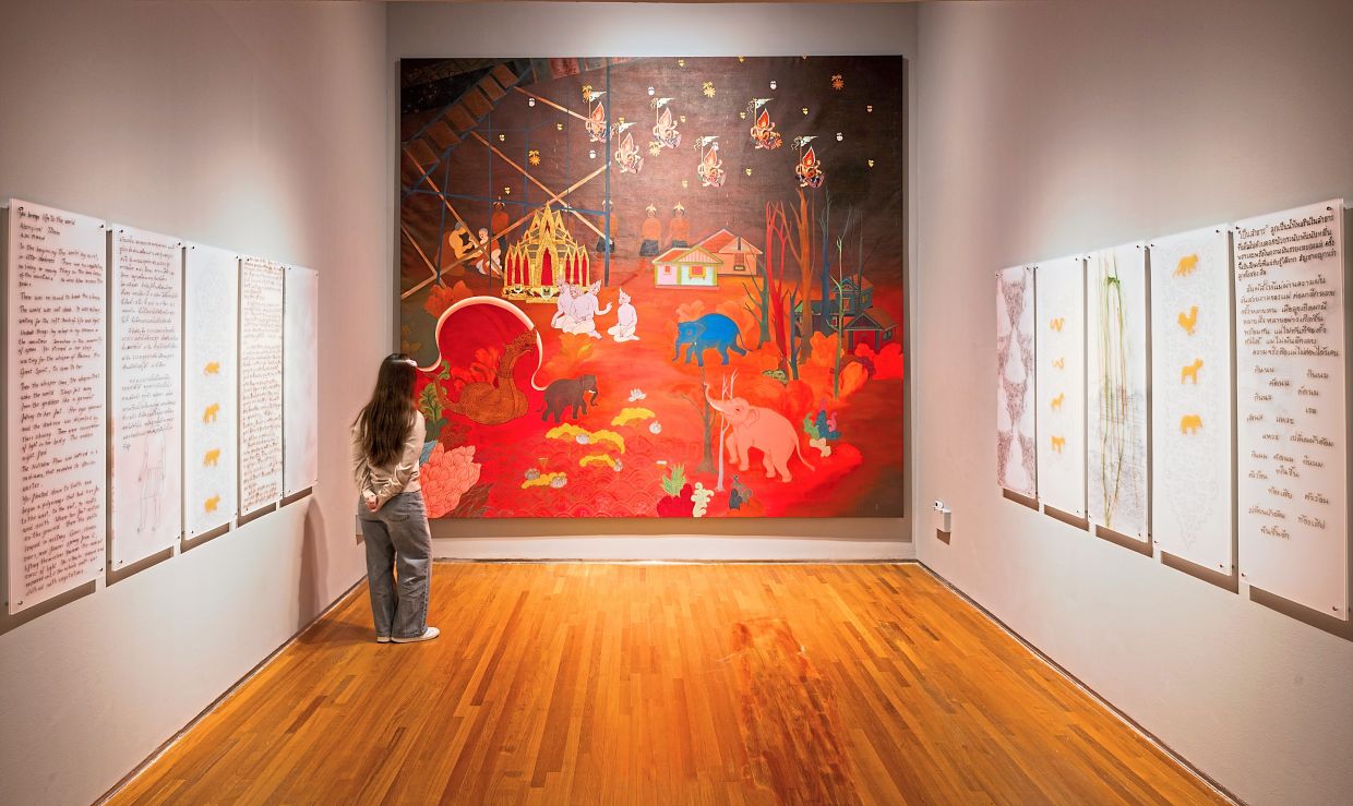 An installation view of Phaptawan’s 'The Sun’s Spell' (2026), a multi-panel mural installation specially commissioned for the exhibition. Photo: National Gallery Singapore
