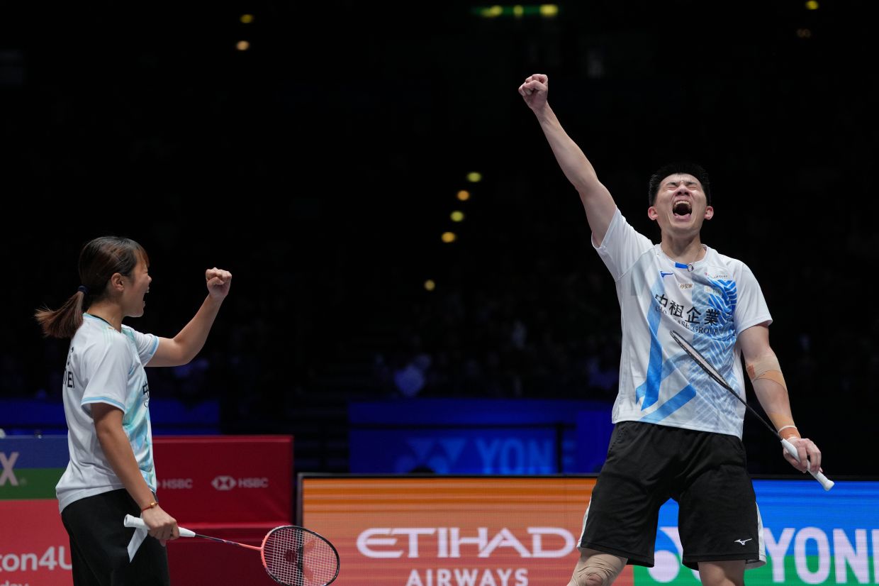 Taiwan's Ye Hong-wei and Nicole Chan celebrate after winning the mixed doubles final match against France's Thom Gicquel and Delphine Delrue at the All-England. - AP