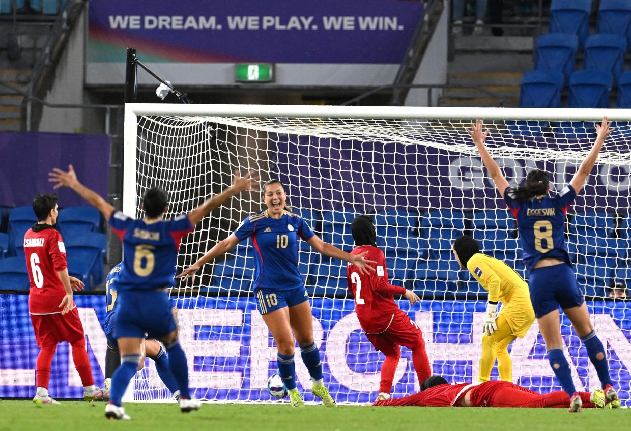 Philippines' Chandler McDaniel, center, celebrates after scoring a goal during the Women's Asian Cup soccer match between Iran and the Philippines in Robina, Australia, on Sunday, March 8, 2026. -- Photo: Dave Hunt/AAPImage via AP