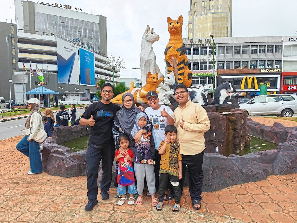 Suhana (second from left) from Sibu, with her family in Kuching.
