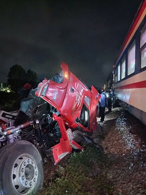 The tractor-trailer split in two after the March 6 collision. - Photo: nhandan.vn