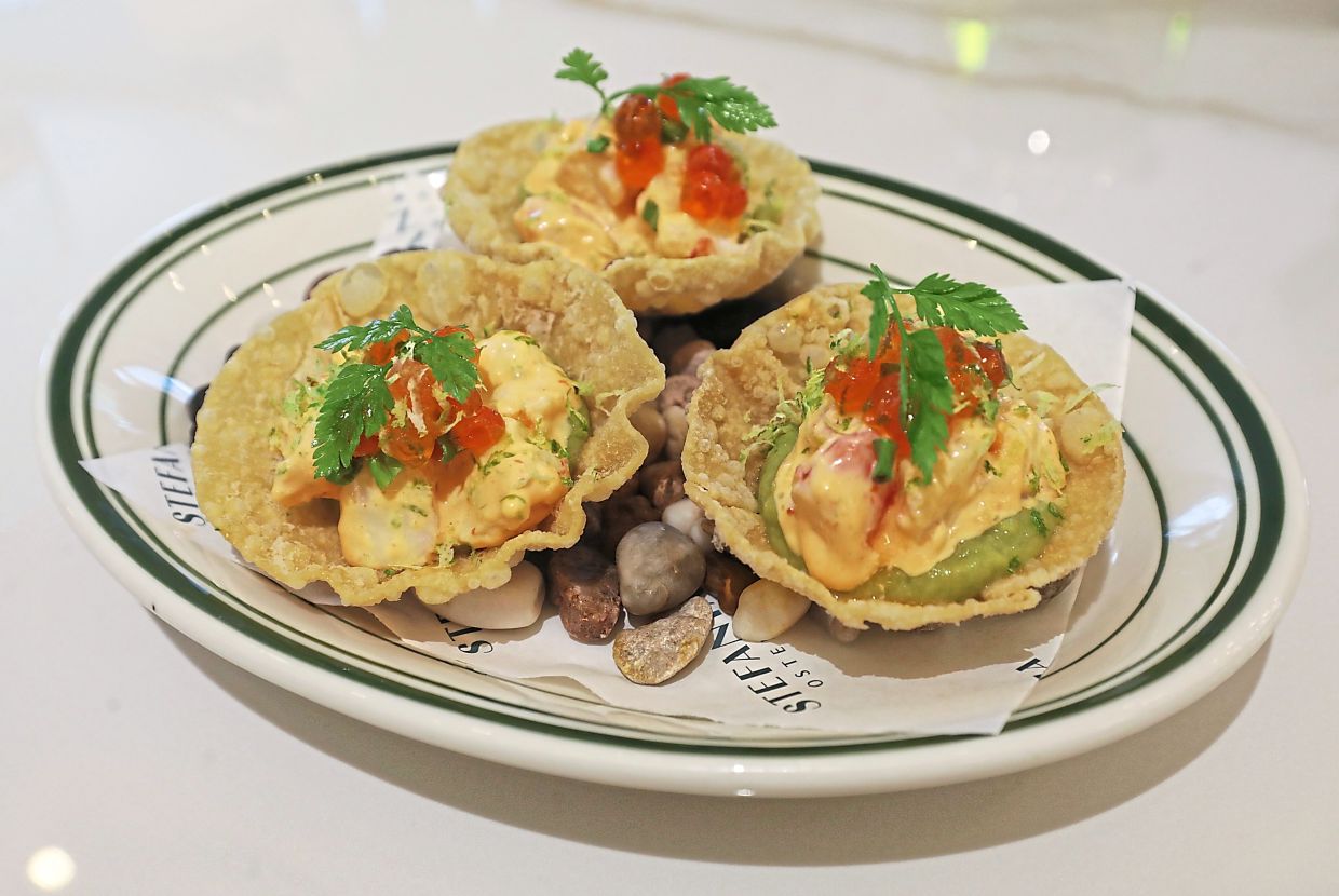 Fat prawns saturated in a creamy dressing and planted in a crispy wanton shield make for a delicious combination of flavours and textures. — SAMUEL ONG/The Star