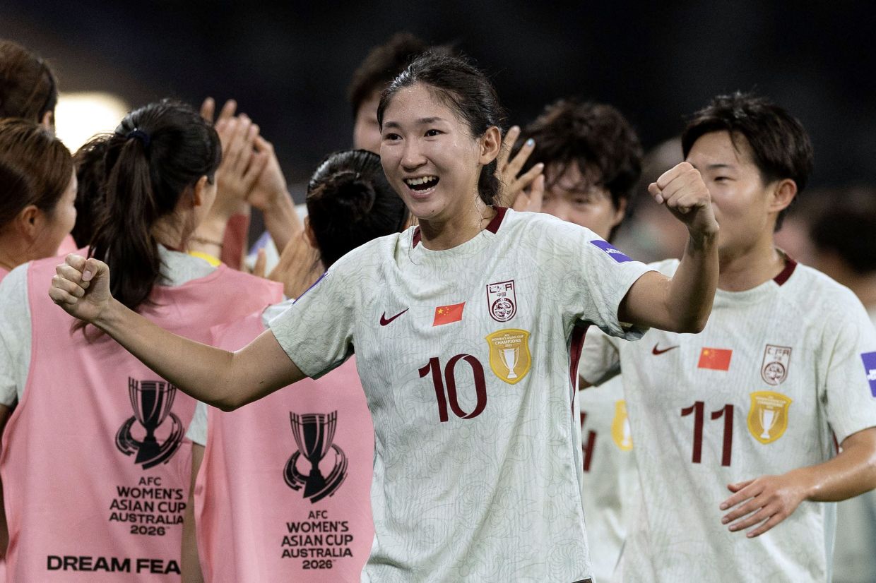China's Wang Yanwen celebrates with teammates after winning the AFC Women's Asian Cup Australia 2026 football match between China and North Korea in Sydney on March 9, 2026. -- Photo by Steve CHRISTO / AFP