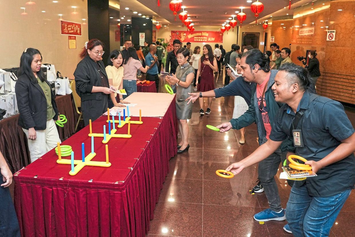 A night of camaraderie as media practitioners take the opportunity to play games (above)