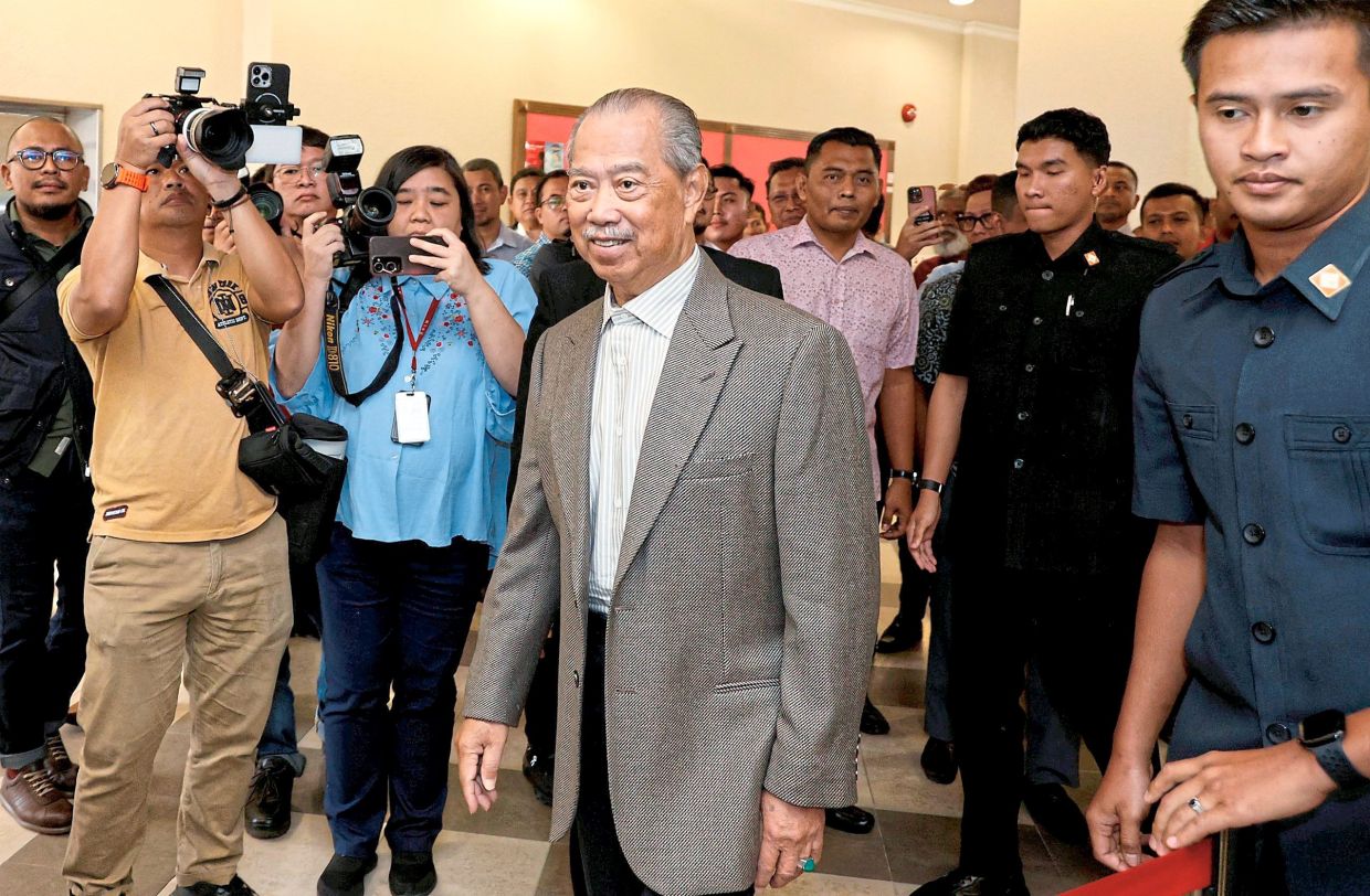 Day in court: Muhyiddin arriving at the Kuala Lumpur Courts Complex for the first day of his trial on graft charges linked to the Jana Wibawa Project.