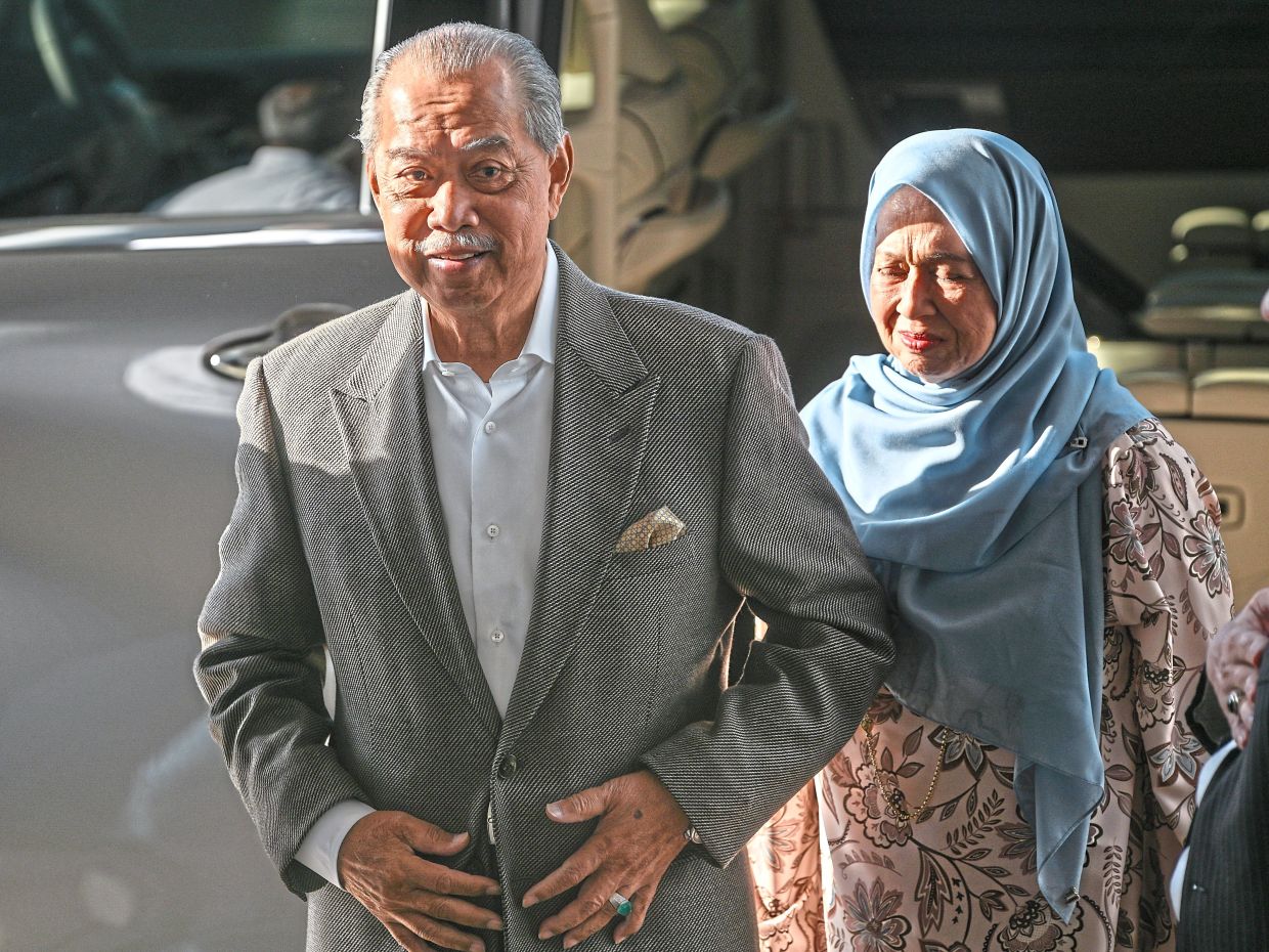 Day in court: Muhyiddin and his wife appearing at the Kuala Lumpur Court Complex for the second day of his trial involving charges of abuse of power and money laundering. — Bernama