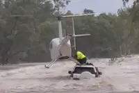 Helicopter rescue saves men, dog from Australian floodwaters