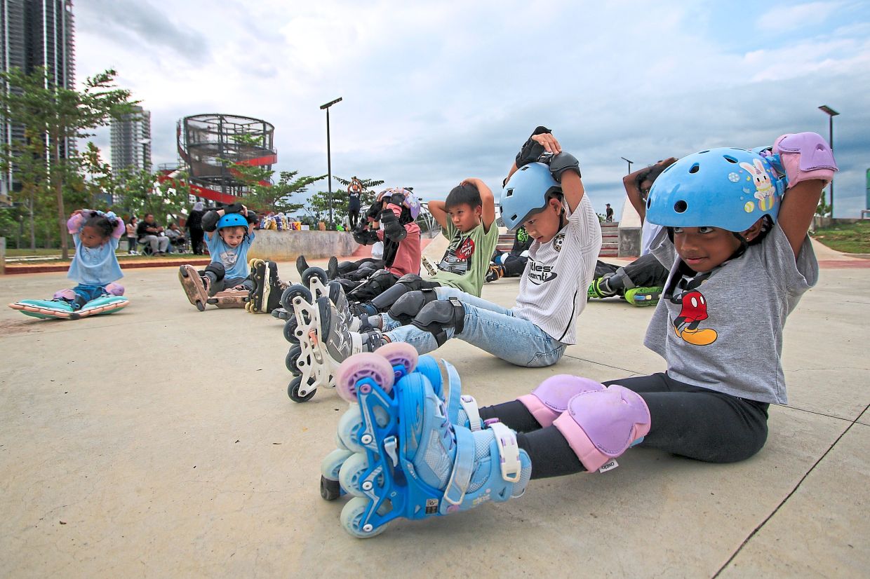 Young participants are taught the importance of warming up.