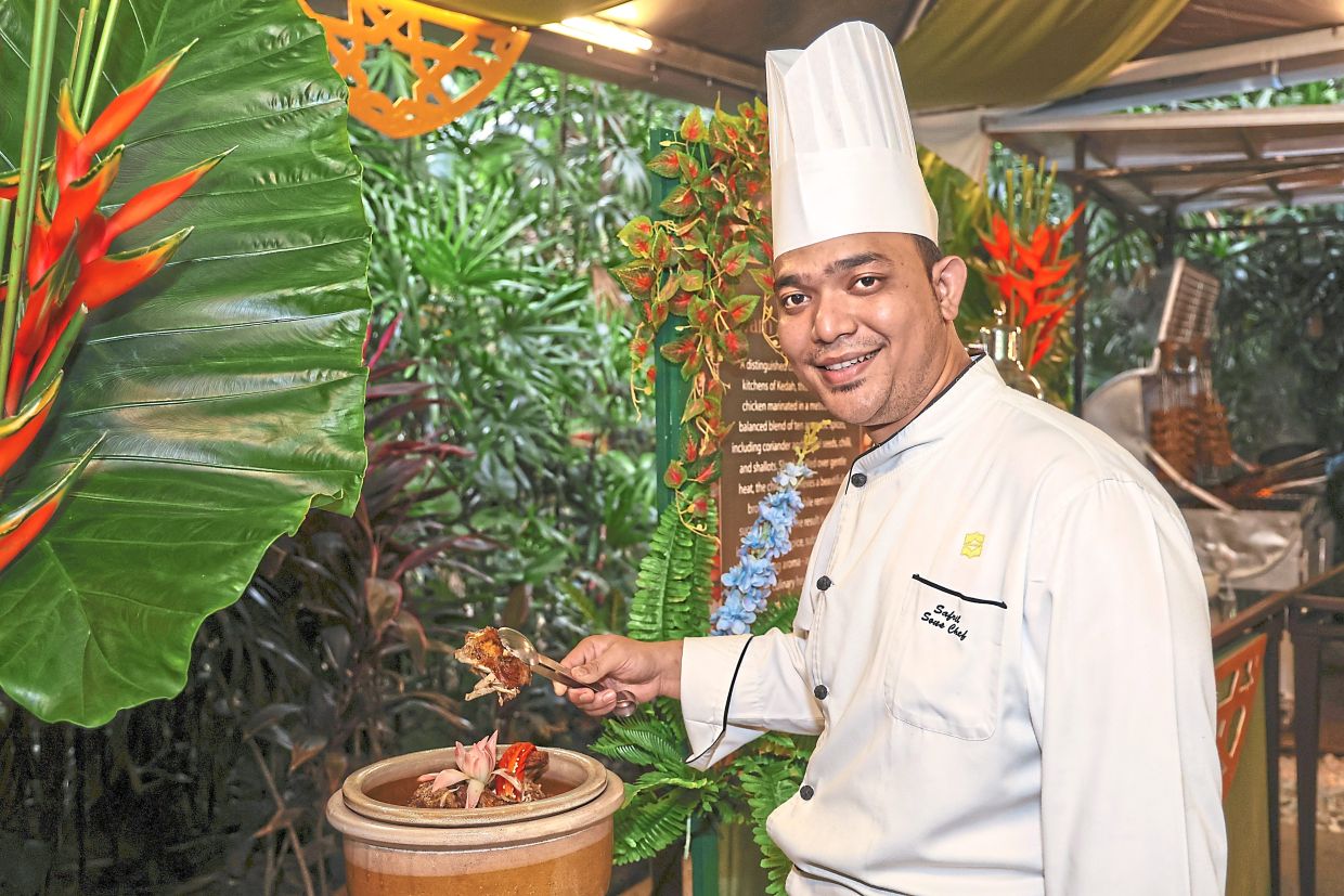 Mohammad Safril with the royally tender Ayam Golek Istana.