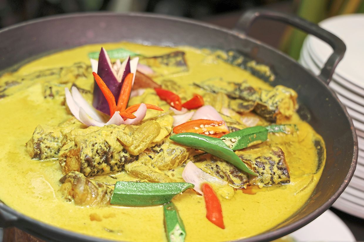 Pais Ikan Jenahak Berempah (above) and Keli Salai Masak Lemak Cili Padi with Belimbing Buluh (left) among buffet highlights at Shangri-La Kuala Lumpur for break of fast. — Photos: GLENN GUAN/The Star