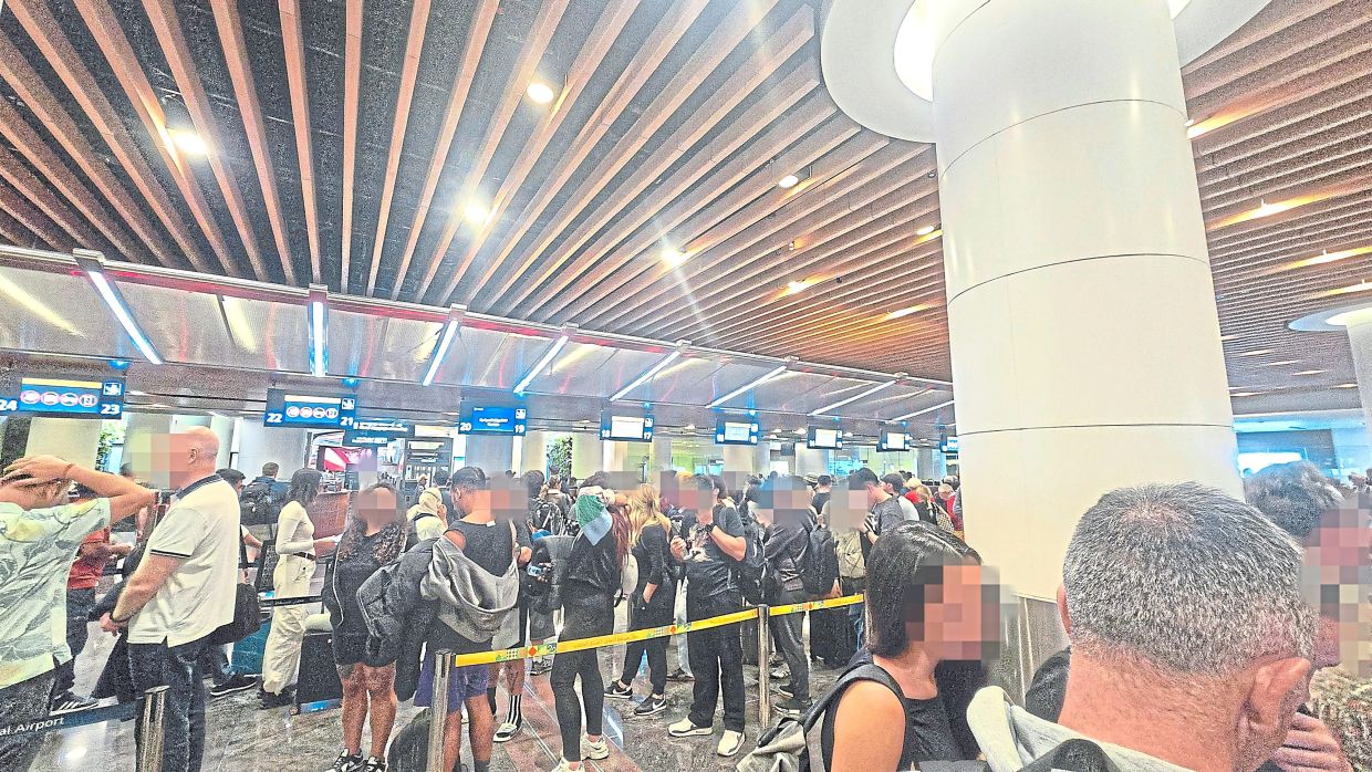 Thousands of passengers going through immigration at the Muscat International Airport on Feb 28.