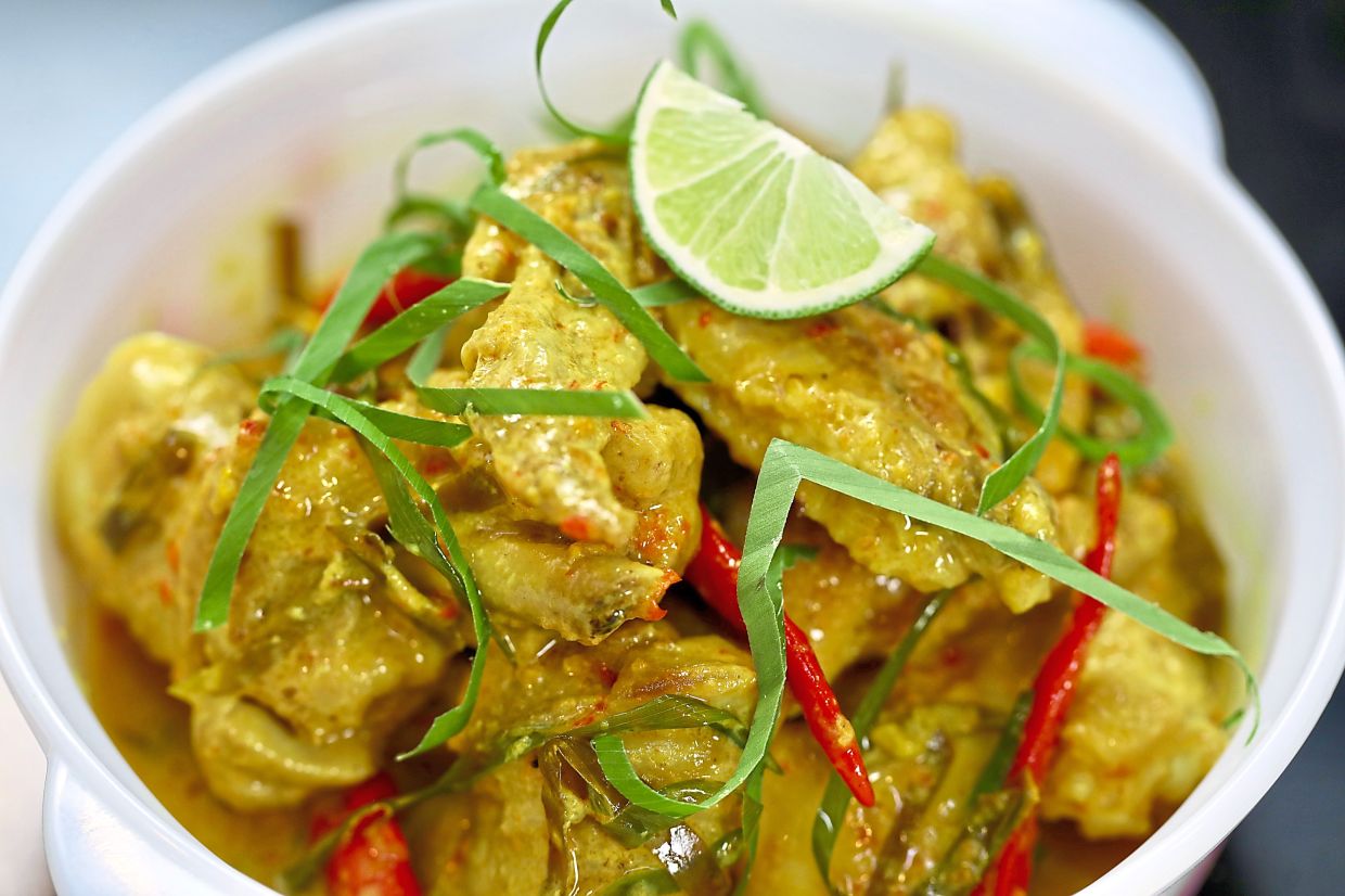 The thick gravy for ayam masak lemak cili api is best enjoyed with lemang or ketupat, whereas the thinner gravy is excellent with steamed rice. — LOW LAY PHON/The Star
